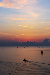 sunrise sky and seascape with silhouette cottage