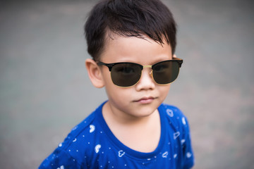 Attractive Asian boy with sunglasses