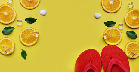 Red Flip Flop Orange Leaves Citrus Ice Sea Shells Citrus on Yellow Background Copy Space