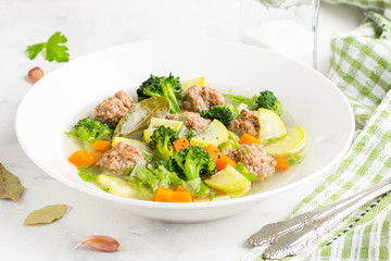 Vegetable soup with beef meatballs, carrots, cabbage, zucchini, broccoli, healthy homemade lunch