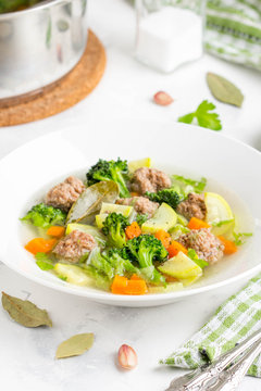 Vegetable soup with beef meatballs, carrots, cabbage, zucchini, broccoli, healthy homemade lunch