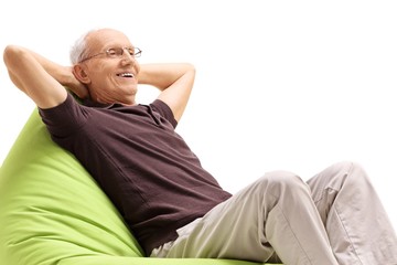 Relaxed senior sitting on a beanbag