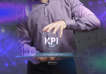 The concept of business, technology, the Internet and the network. A young entrepreneur working on a virtual screen of the future and sees the inscription: KPI