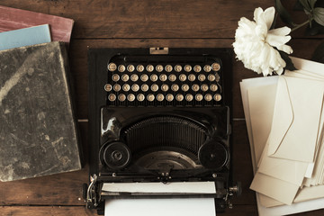 Old black typewriter with paper worth on the table