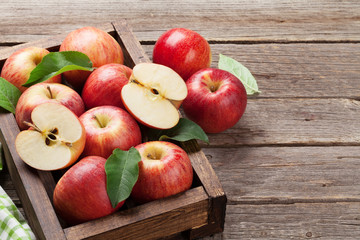 Red apples in wooden box