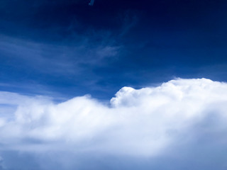 Obraz premium White big cloud on blue sky