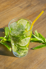 Mojito cocktail with fresh lime, mint and ice