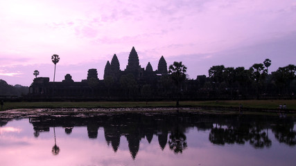 Fototapeta na wymiar Sunrise at Angkor Wat, historical ruins of Angkor Khmer Empire, Siem Reap, Cambodia