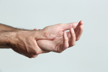 Wrist injury, man with Carpal tunnel syndrome symptom