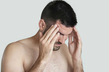 Fototapeta premium Young man with headache, portrait of worried young man 