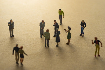 Miniature people meeting.