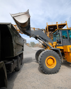 diesel loader will load construction crushed stone.
