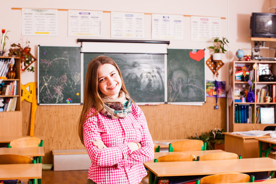 Young woman teacher in the classroom