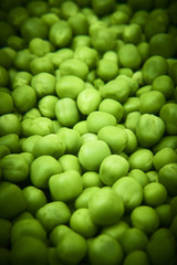 Fresh green peas background texture top view
