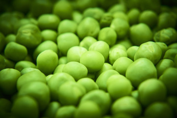 Fresh green peas background texture top view
