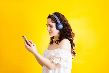 young girl wearing wireless headphones