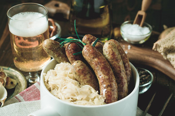 Traditional German Grilled Sausages Bratwurst with Cabbage Salad, Mustard and Beer