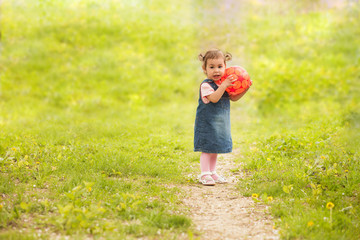 adorable baby girl playing outdoors