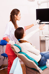 Dentist with and female patient