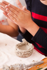 Child hands with plasticine