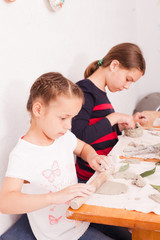 Child hands with plasticine