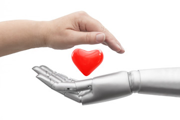 Konzeptionelles Foto wie das Leben geschützt wird. Eine Roboter Hand und eine menschliche Hand umgeben schützend ein Herz. Freigestellt vor weißem Hintergrund. - obrazy, fototapety, plakaty