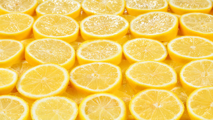 A slices of fresh juicy yellow lemons