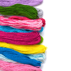 Colorful thread on white background with copy space.