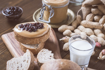 Fresh Peanut Butter and Jelly Sandwich on Old Rustic Wooden Cutting Board
