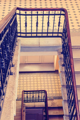 Fototapeta premium A fragment of an old marble staircase and a railing. Toning in the style of instagram.