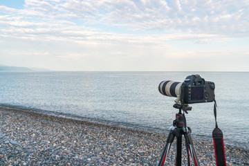 Camera on the tripod, stony beach in kvariati, Adjara, Georgia