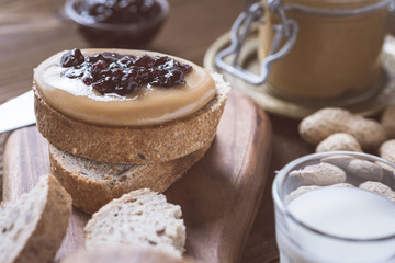 Fresh Peanut Butter and Jelly Sandwich on Old Rustic Wooden Cutting Board