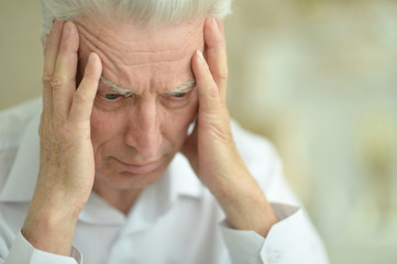 Senior man with headache 