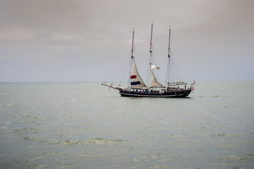 Fototapeta premium Merker Wadden, 17.06.2018: Netherlands, Image of the beautiful sailing boat cruising near coast line of Merker Wadden, Netherlands