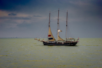 Fototapeta premium Merker Wadden, 17.06.2018: Netherlands, Image of the beautiful sailing boat cruising near coast line of Merker Wadden, Netherlands