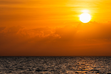 Fototapeta na wymiar Beautiful cloudscape over the sea, scenic dramatic golden sunset