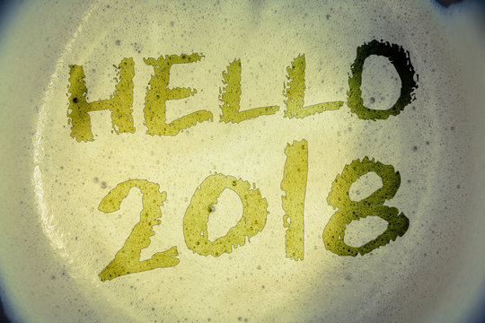 Writing note showing  Hello 2018. Business photos showcasing Starting a new year Motivational message 2017 is over nowIdeas messages concepts words letters created on foamy coffee background