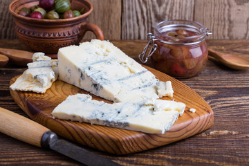 Gorganzola cheese with fresh gooseberries and berry jam - obrazy, fototapety, plakaty