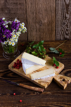 French brie cheese and wild strawberries