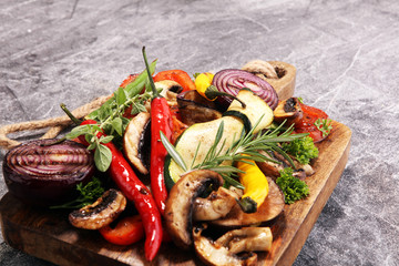 Grilled vegetables. Tomatoes, zucchini, bell pepper and fresh herbs.