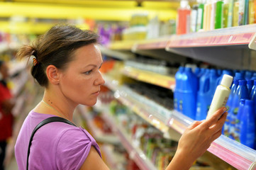 Young woman choosing cream