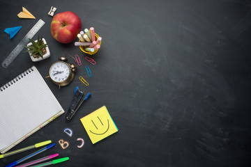 Banner concept Back to School Alarm clock, pencil Apple Notebook Stationery on blackboard...