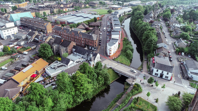 Low level aerial image of the Forth and Clyde Canal in the town of Kirkintilloch in Scotland.