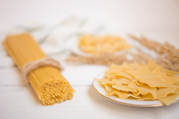 different types of paste and a towel on a white wooden table