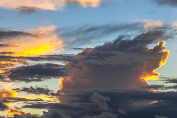 Fototapeta premium Fancy shapes of clouds at evening sunset.
