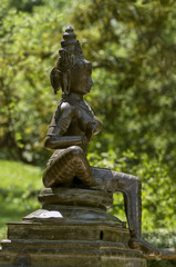 Fototapeta na wymiar Brass statue of the Goddess Parvati. Statue of Indian goddess of fertility, love and devotion.