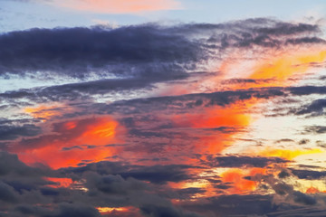 Layered forms of beautiful clouds with red sunset.