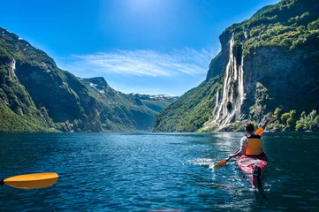 Foto op Canvas man kayaking along the fjord © sergii