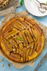 Banana tart tarte tatin with caramel and walnuts