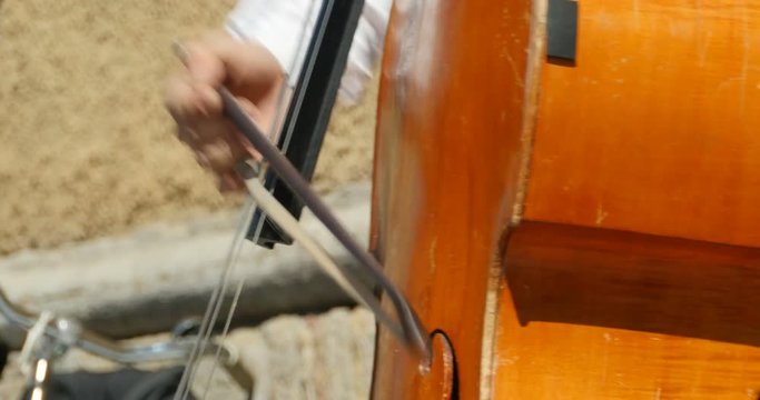 play contrabass string musical instrument close-to
